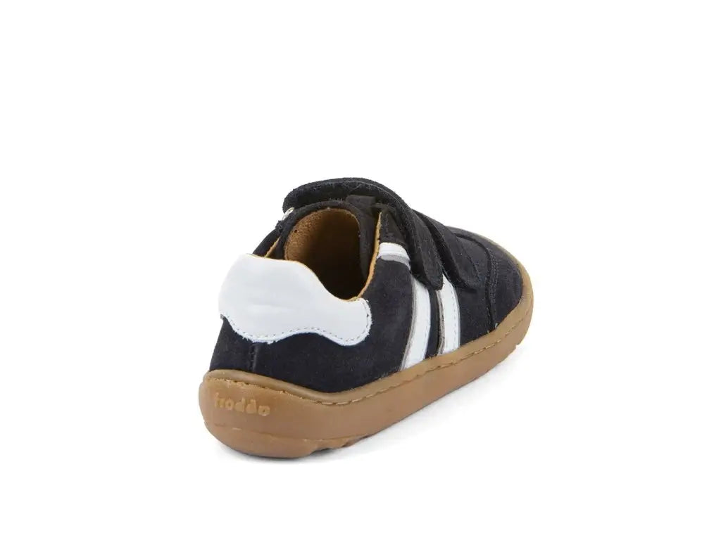 Black and white barefoot shoe with a brown sole on